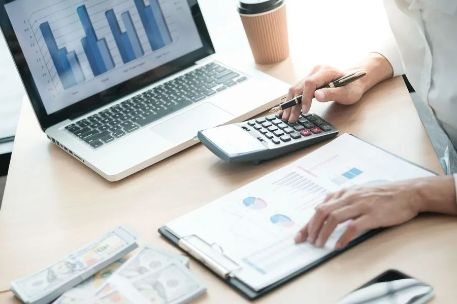 Accountant reviewing financial reports and reconciliations